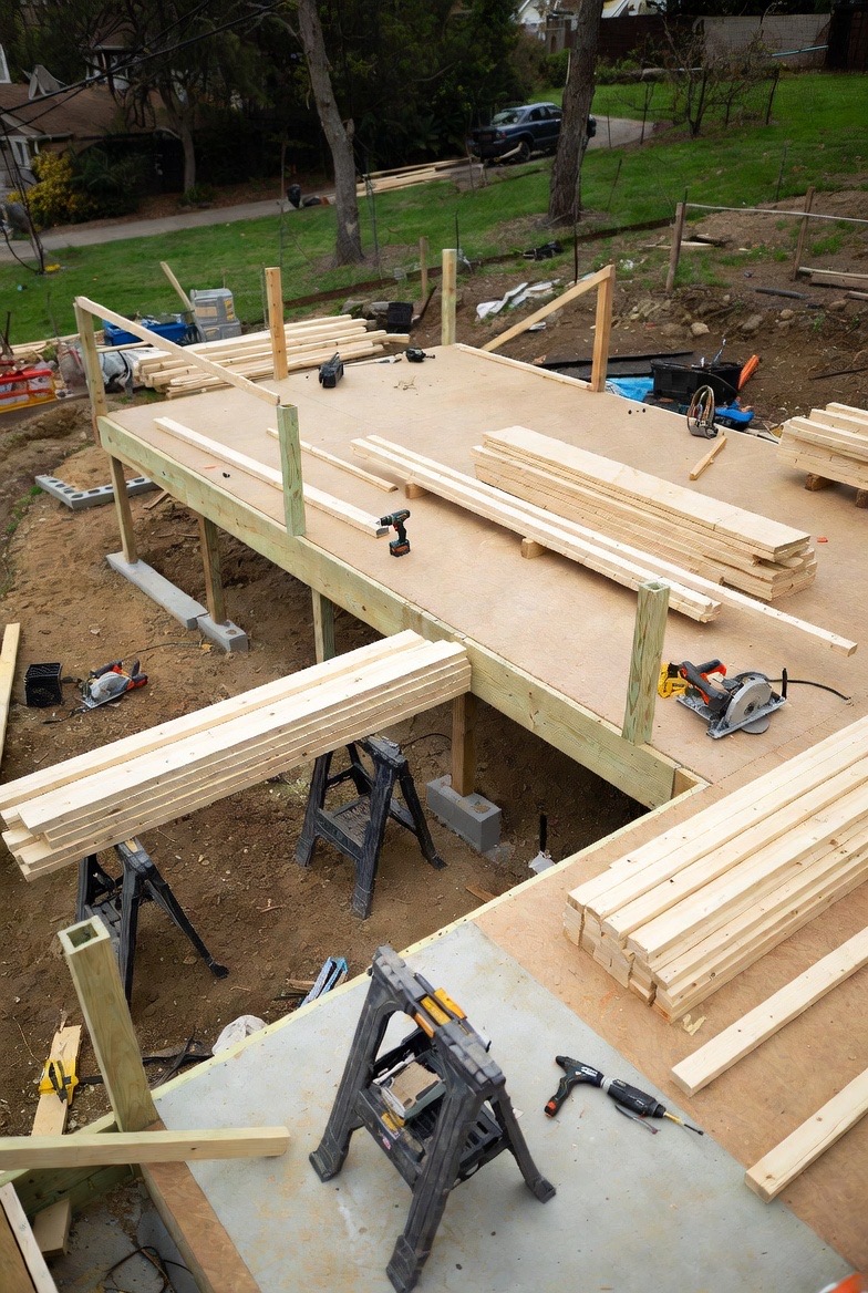 Contractor explaining options to homeowners at a kitchen table